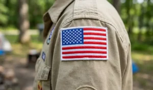American flag patch placement on the right shoulder of a Boy Scout uniform, stars forward